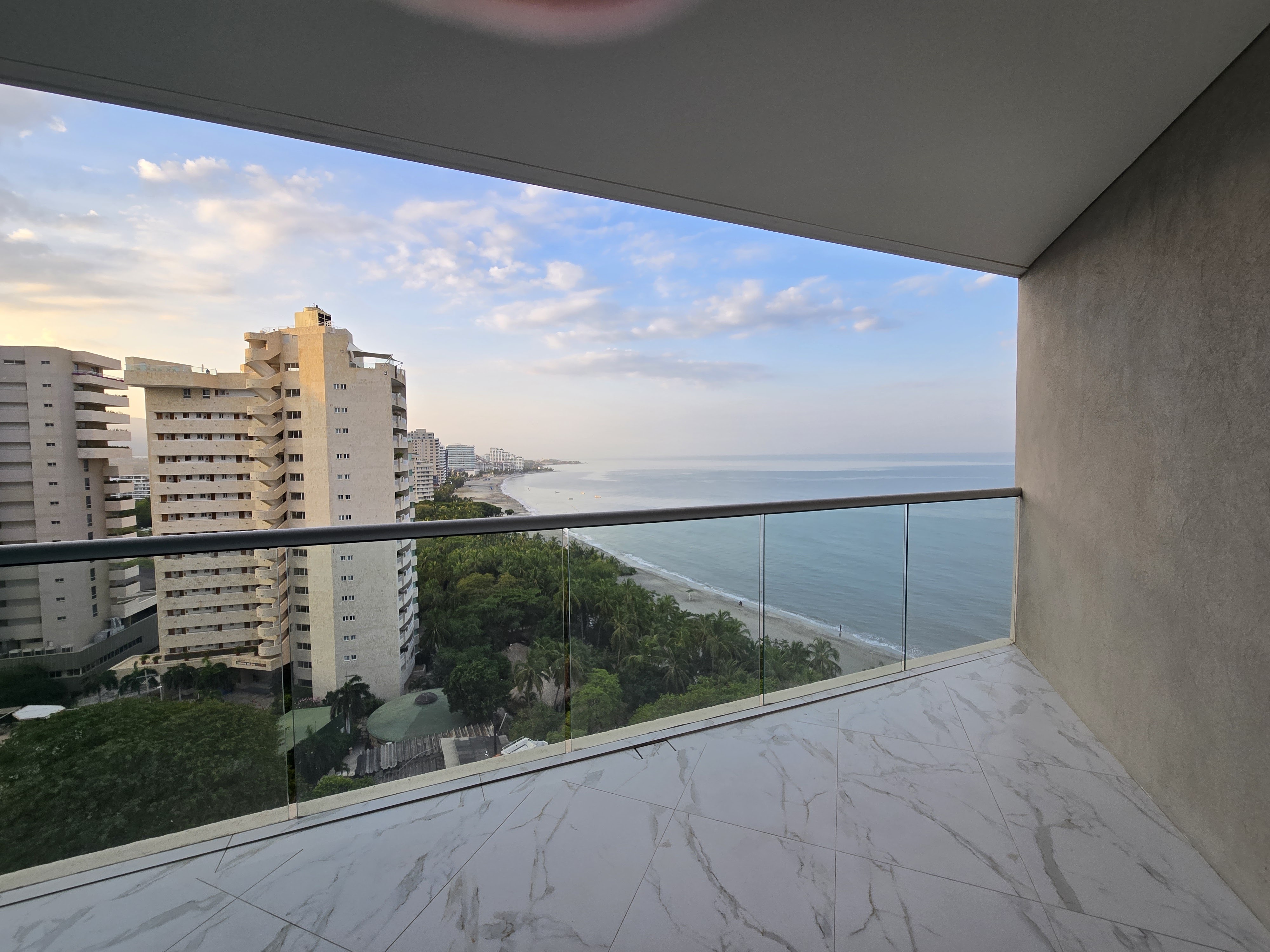 City meets sea: morning calm over vibrant streets and endless Caribbean waves.