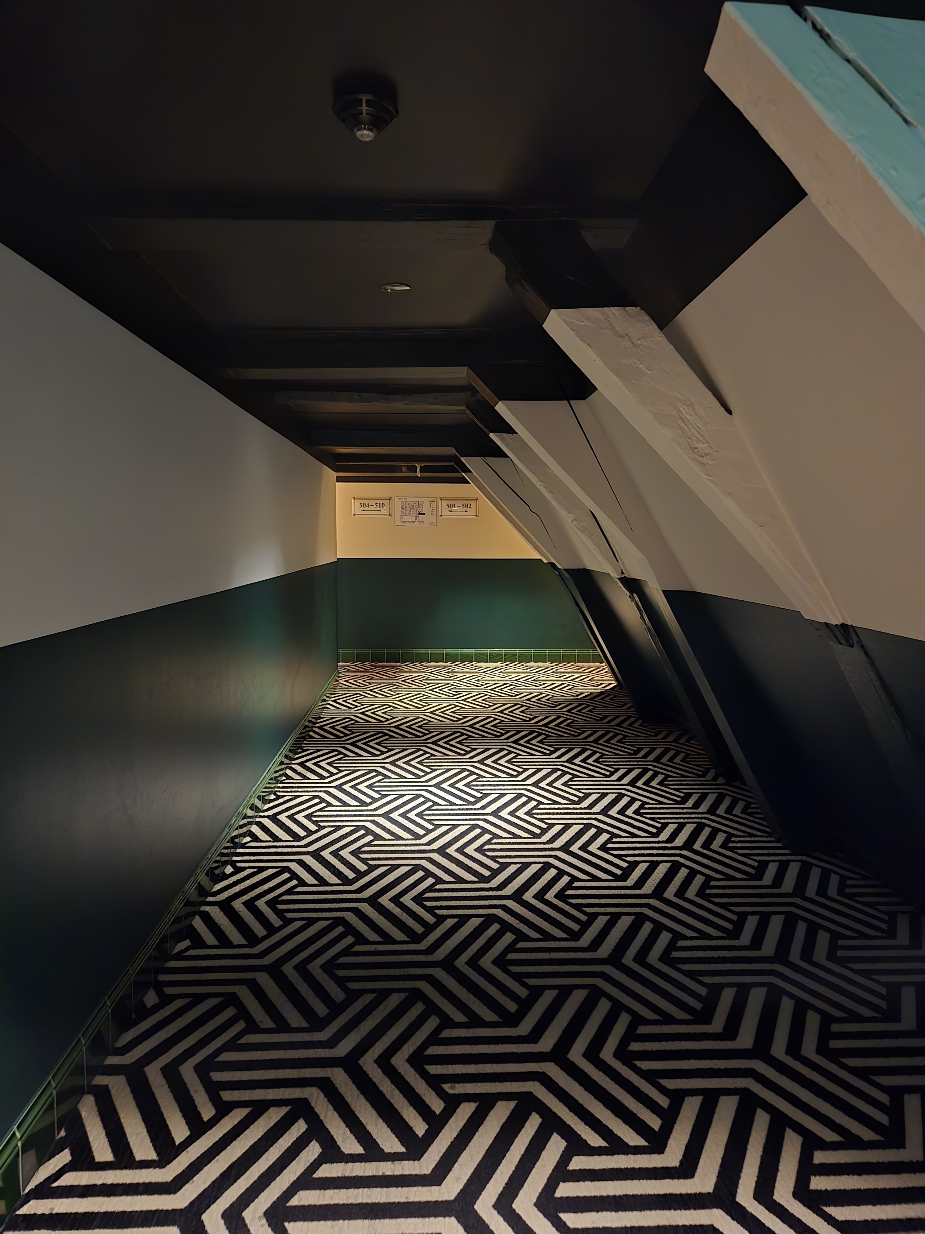 Winding through hidden city corners, where geometry meets shadow in unexpected harmony.