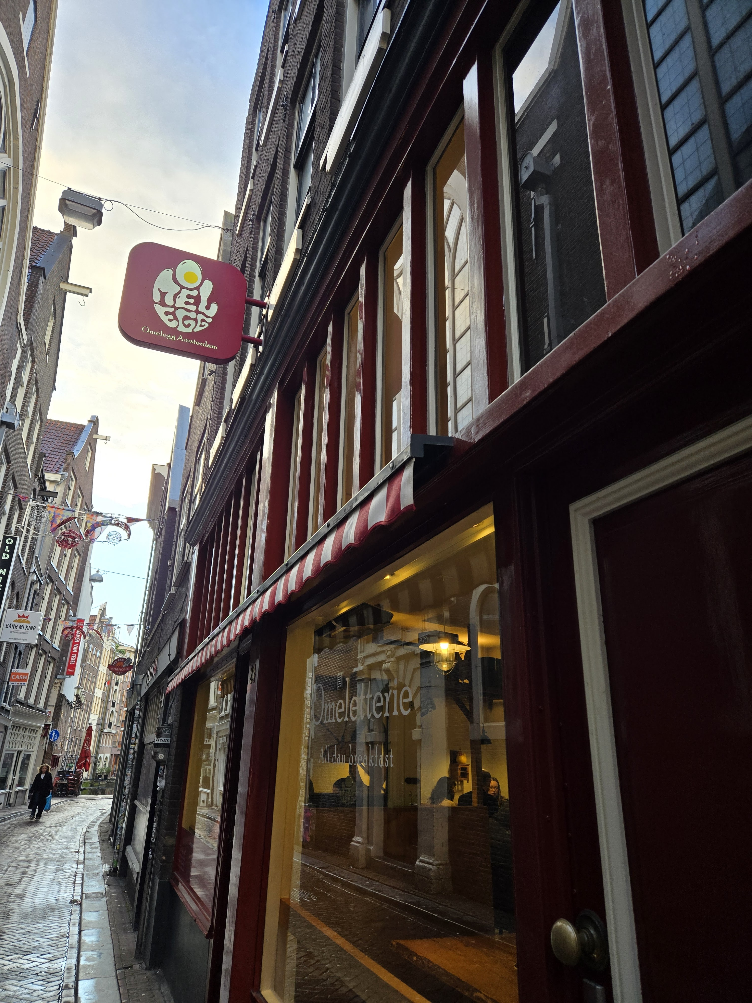 Cozy morning vibes in a narrow street café, savoring rich flavors and city stories at every turn.